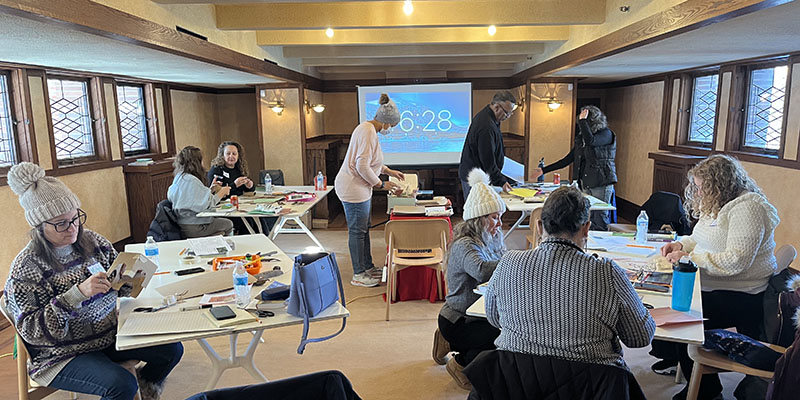During the Biomimicry: Inspired by Nature session, educators collaborate in teams to create architectural models that meet specific design requirements. 