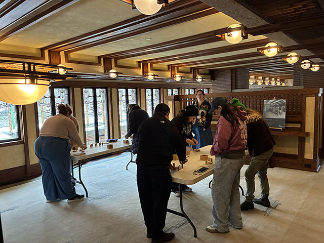 In Robie House’ dining room, educators use Froebel blocks to create physical representations of abstract ideas.